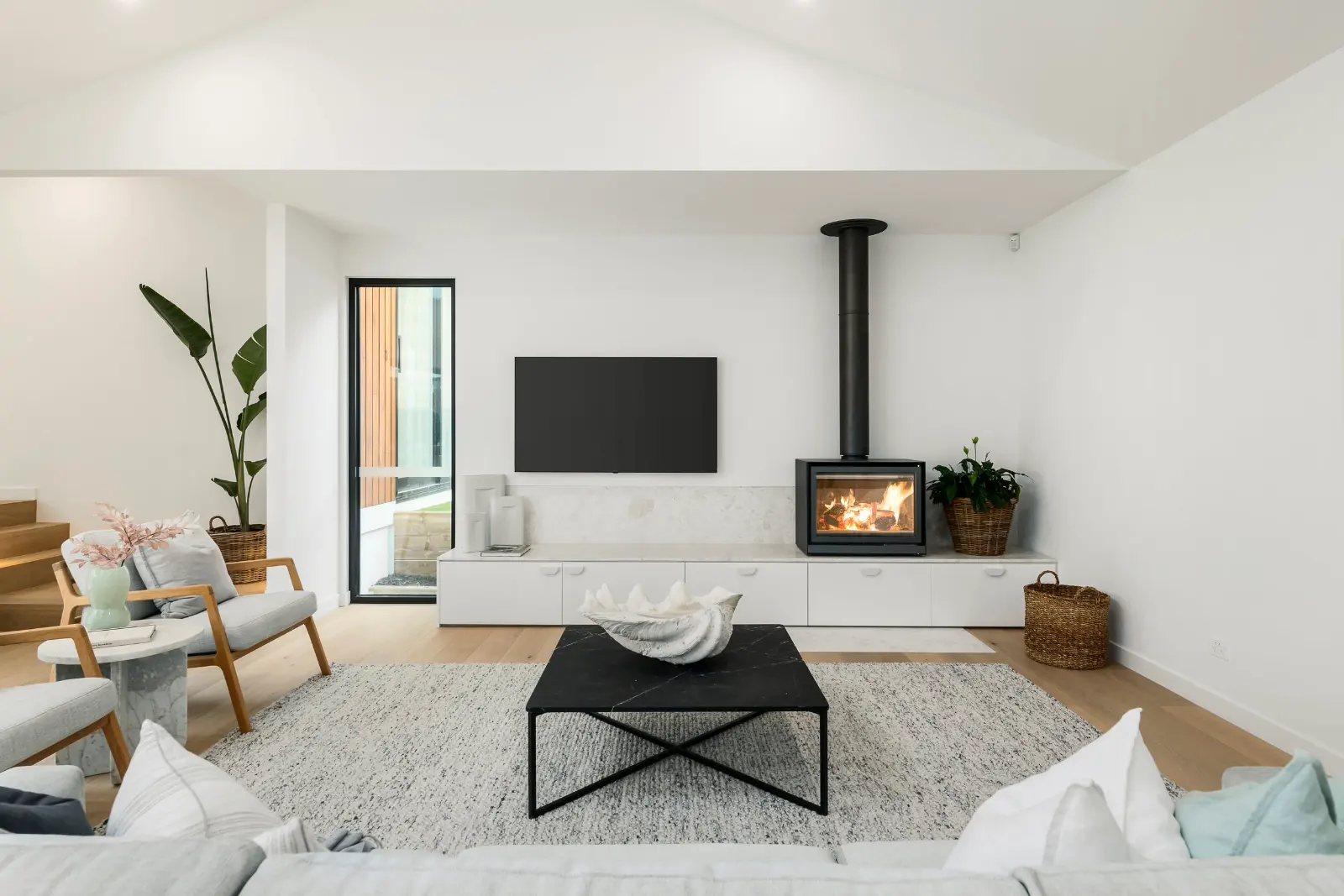 Prince Street, Mornington. Living room with the wood heater.